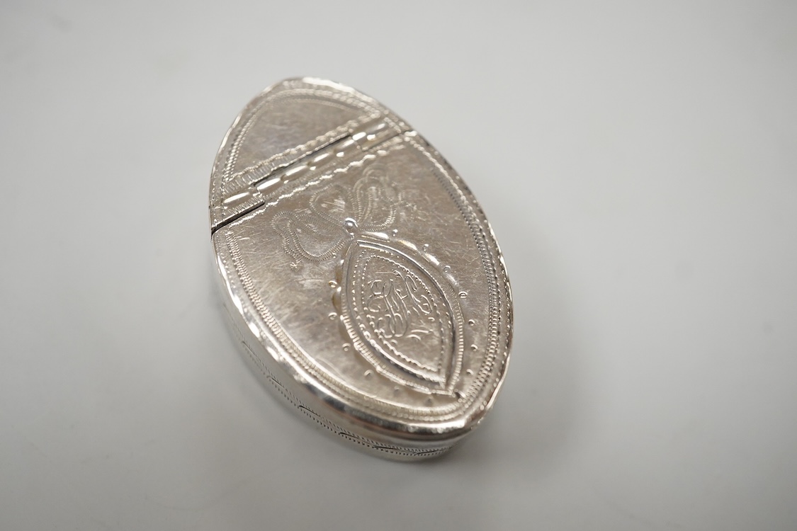 Two George III engraved silver oval patch boxes, largest with hinged cover, Samuel Pemberton, Birmingham, 1818, 28mm, the smaller by John Thornton, Birmingham, 1800.